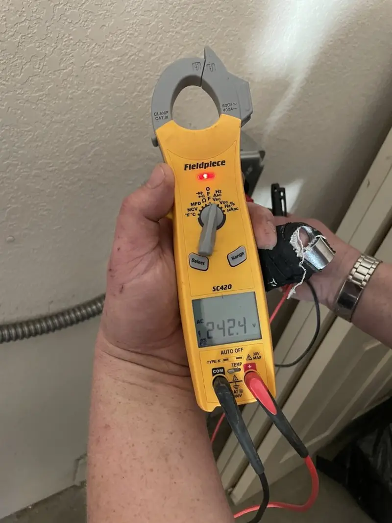 Voltage testing with clamp meter during Electrical Installation Services in Bensenville